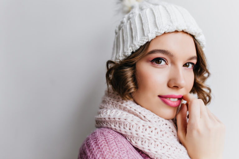 Close Up Portrait Of Refined Curly Woman In White Hat. Ecstatic European Girl With Beautiful Eyes Posing In Cute Scarf..