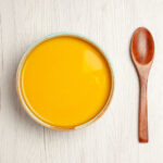 Top View Delicious Cream Soup Yellow Colored Soup White Desk Soup Sauce Meal Cream Dinner Dish